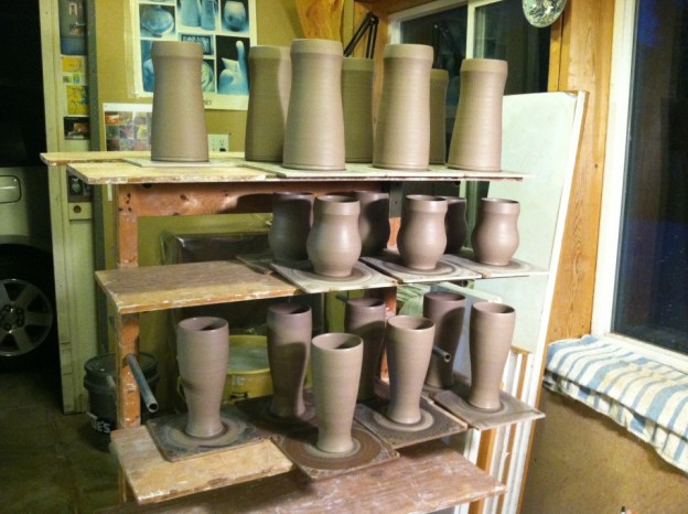 Cup forms just off the wheel with no handles yet.